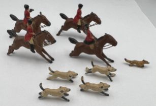Lead hunting figures to include four horses, four dogs and a fox. Horses approximately 4cm l.