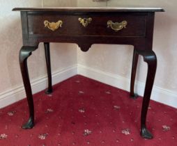 An 18thC oak lowboy with trefoil pad feet. 74cm w x 47cm d x 65cm h.