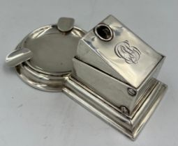 A hallmarked silver table cigar cutter and ashtray. Birmingham 1908, maker’s marks rubbed. Weight