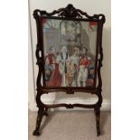 A fine quality rosewood firescreen with wool and beadwork embroidery depicting the christening of