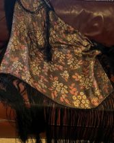 A vintage floral shawl with deep black fringing. Size approximately 84cm x 90cm.