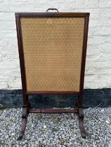 An embroidered mahogany extendable firescreen. 109 h x 56 w x 43cm d.