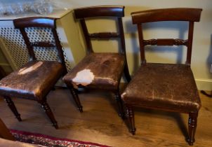 Three 19thC bar backed mahogany dining chairs with leather seats.