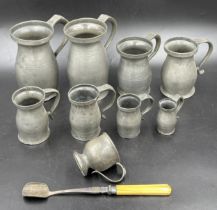 Eight old pewter tankards, various sizes, tallest 17.5cm and smallest 7cm together with a pewter cup