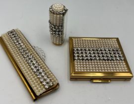 A 1950’s SF Co. Fifth Avenue compact, lipstick and comb holders. Two in original boxes. All