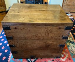 A metal bound oak trunk with metal drop handles to each side and two lift out interior trays. 78cm w