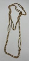 An 18 carat yellow gold chain link necklace Approximately 90cm l. Weight 56.6gm.