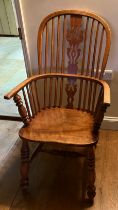 A 19thC high backed ash and elm Windsor armchair. 105cm h to back.