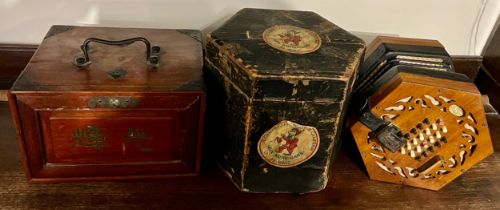 A wooden cased Lachenal concertina, the mahogany ends 16cm w with paper label in original carrying