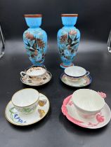 Four 19thC cups and saucers to include two with lozenge marks to base, a Minton with butterfly