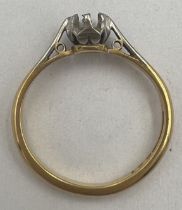 A 18 carat gold and platinum ring lacking stone. Size I, Weight 2.6gm.