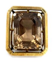 A Smokey quartz brooch set in 14 carat gold. Size approximately 2cm x 2.2cm. Weight 8.3gm.