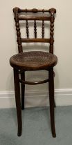 A child’s bentwood high chair with cane seat by Linz of Austria. 88cm h to back.