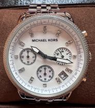 A Michael Kors ladies wristwatch MK-5020 quartz wristwatch. Original box and instruction manual.