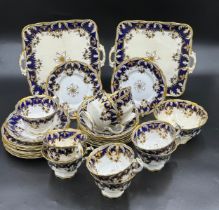 A Staffordshire 1860 part tea service with Gold and Cobalt hand painted colours, pattern No. 7113,