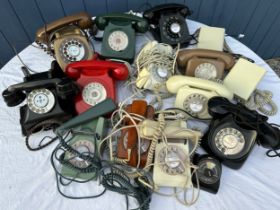 A large quantity of various vintage and model telephones to include P.O., G.P.O. timer, a Smiths