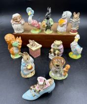 Twelve Royal Albert The World of Beatrix Potter figurines to include 'The Old Woman who lived in a