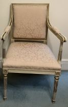 A painted and gilt upholstered open armchair. 97cm h to back.