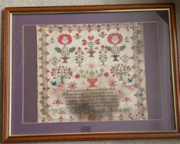 A Georgian needlework sampler by Ruth Ingham aged 17 years and dated 1825, depicting mostly