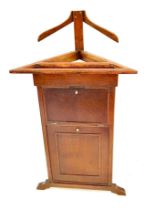 A valet butler stand of triangular form. 106 x 58cm w x 39cm d.