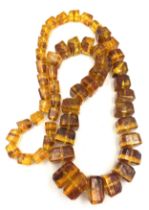 An amber bead necklace 76cm l. Weight 145.9gm.