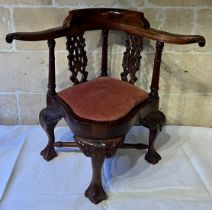 A miniature wooden corner chair on ball and claw feet and drop in seat. 30cm h to back.