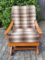 A mid 20th century upholstered rocking chair. 82cm h x 60cm w x 68cm d