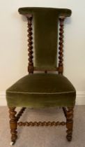 A 19thC walnut prie dieu chair with barley twist stretchers and supports. 104cm h to back.