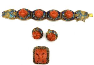 A fine quality Chinese 14 carat yellow gold bracelet set with carved coral and enamel work with