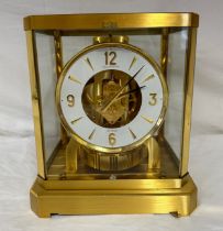 A Jaeger-LeCoultre Swiss Atmos mantel clock, with brushed brass case, five glass panels, white