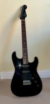 A Fender Aerodyne Stratocaster black electric guitar, made in Japan (2005), S/N. R012126. With Kaces