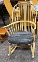 Ercol ‘Chairmaker’ rocking chair with gold lable and original cushions. 104cm h to back.