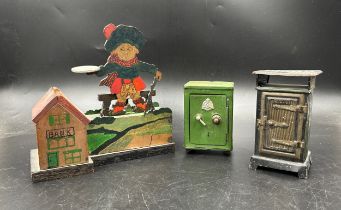 Three vintage money boxes to include two tinplate, Eureka No 410 tinplate stove 13.5cm h, one