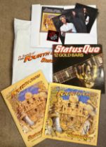 Signed Status Quo records and booklets to include ‘In Search of The Fourth Chord’ and ‘12 Gold
