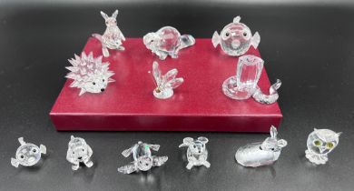 A collection of 12 Swarovski Silver Crystal boxed ornaments to include 7644 Fish, 7616 Beaver,