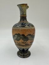 A Doulton Lambeth stoneware baluster shaped vase by Florence. E. Barlow depicting birds, impressed