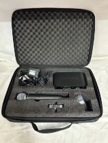 A Shure GLX-D4 handheld digital wireless vocal system Beta 58A with PS43UK adapter in zip up case.