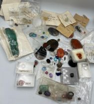 A quantity of unmounted, mainly polished stones to include moss agate, white topaz etc.