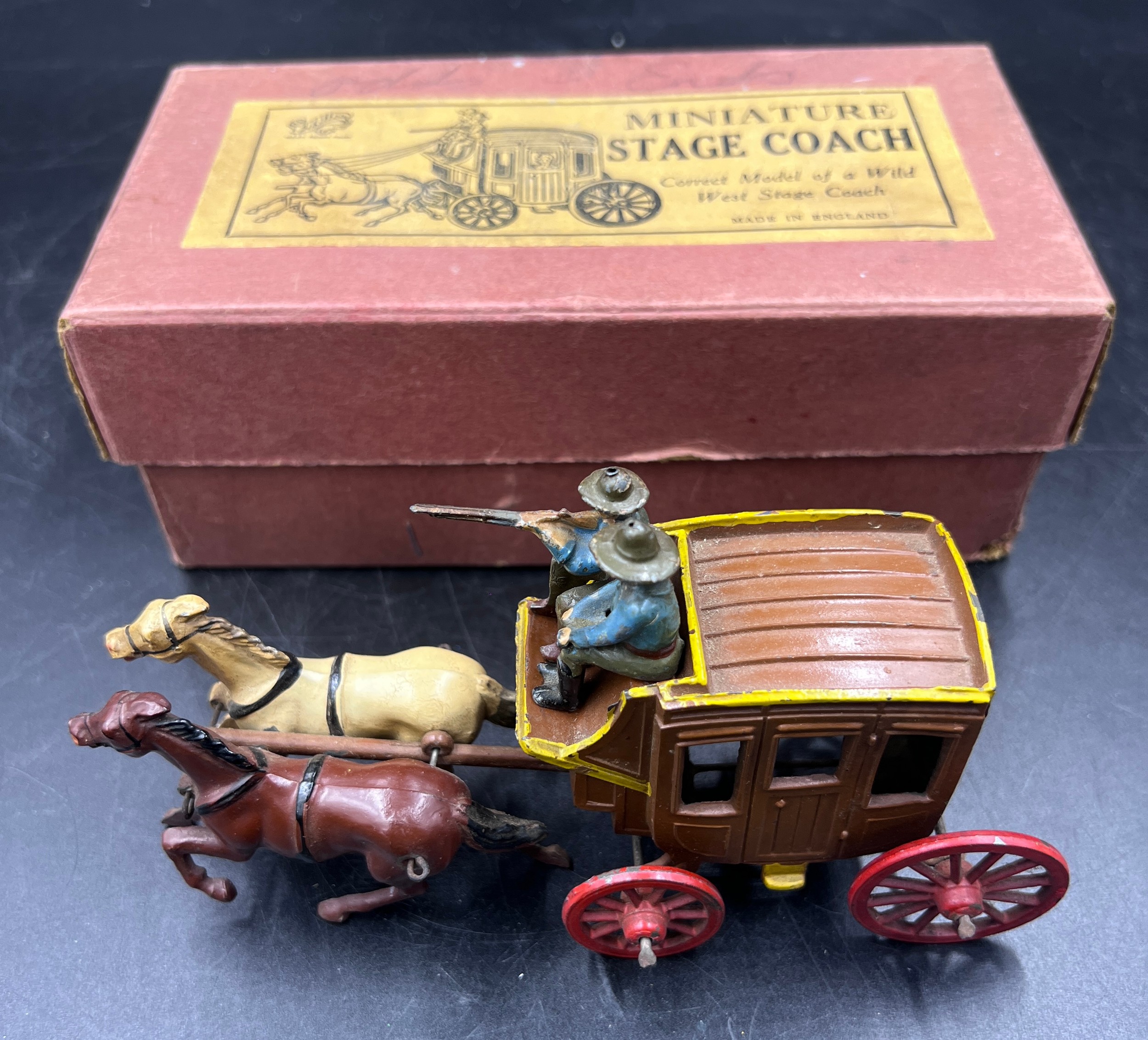 A boxed John Hill and Co Johillco boxed miniature Stage Coach comprising of a brown coach with red