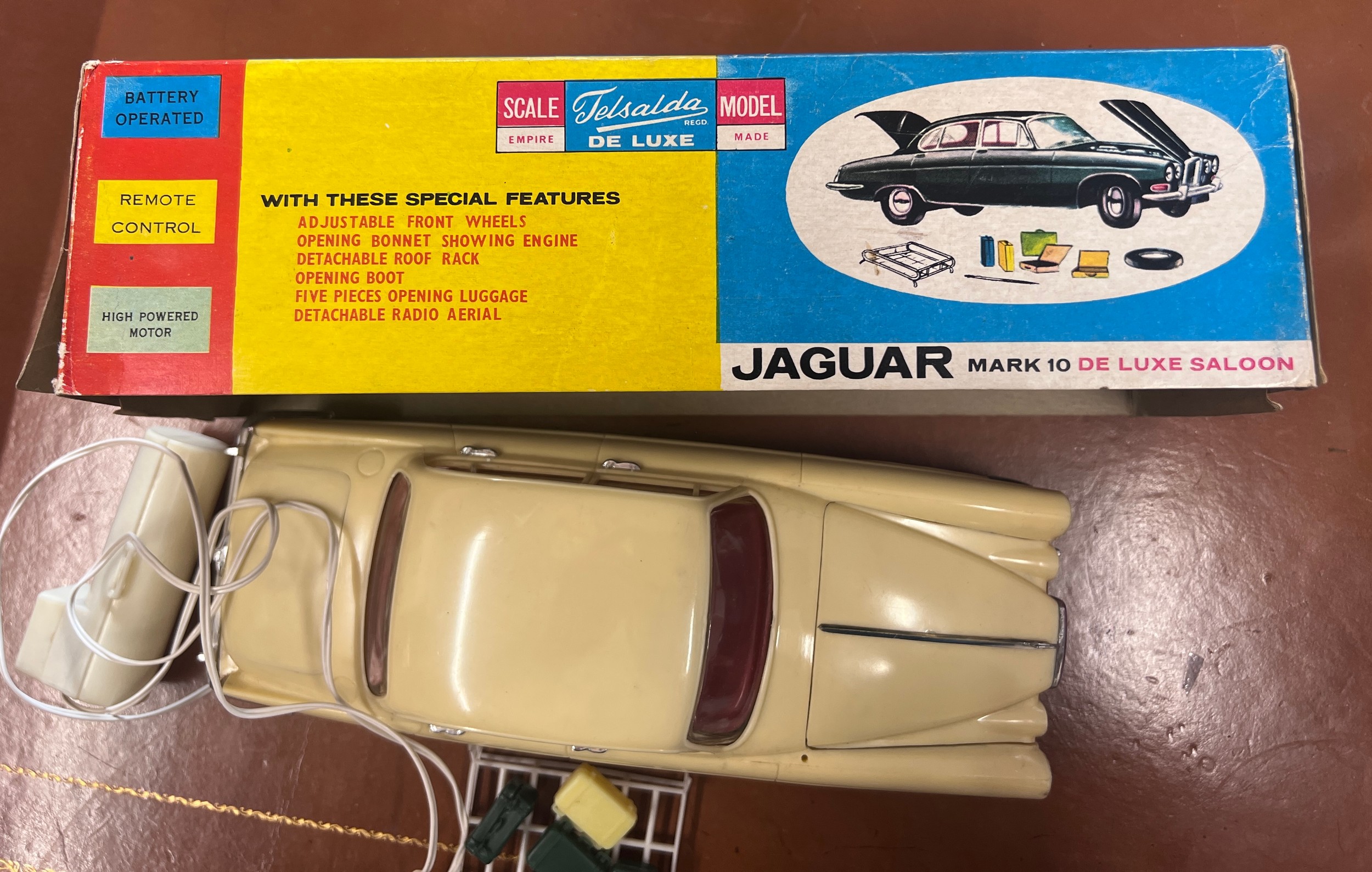 Telsalda De Luxe Jaguar Mark 10 Saloon, cream plastic body with friction motor, roof rack and five - Image 3 of 3