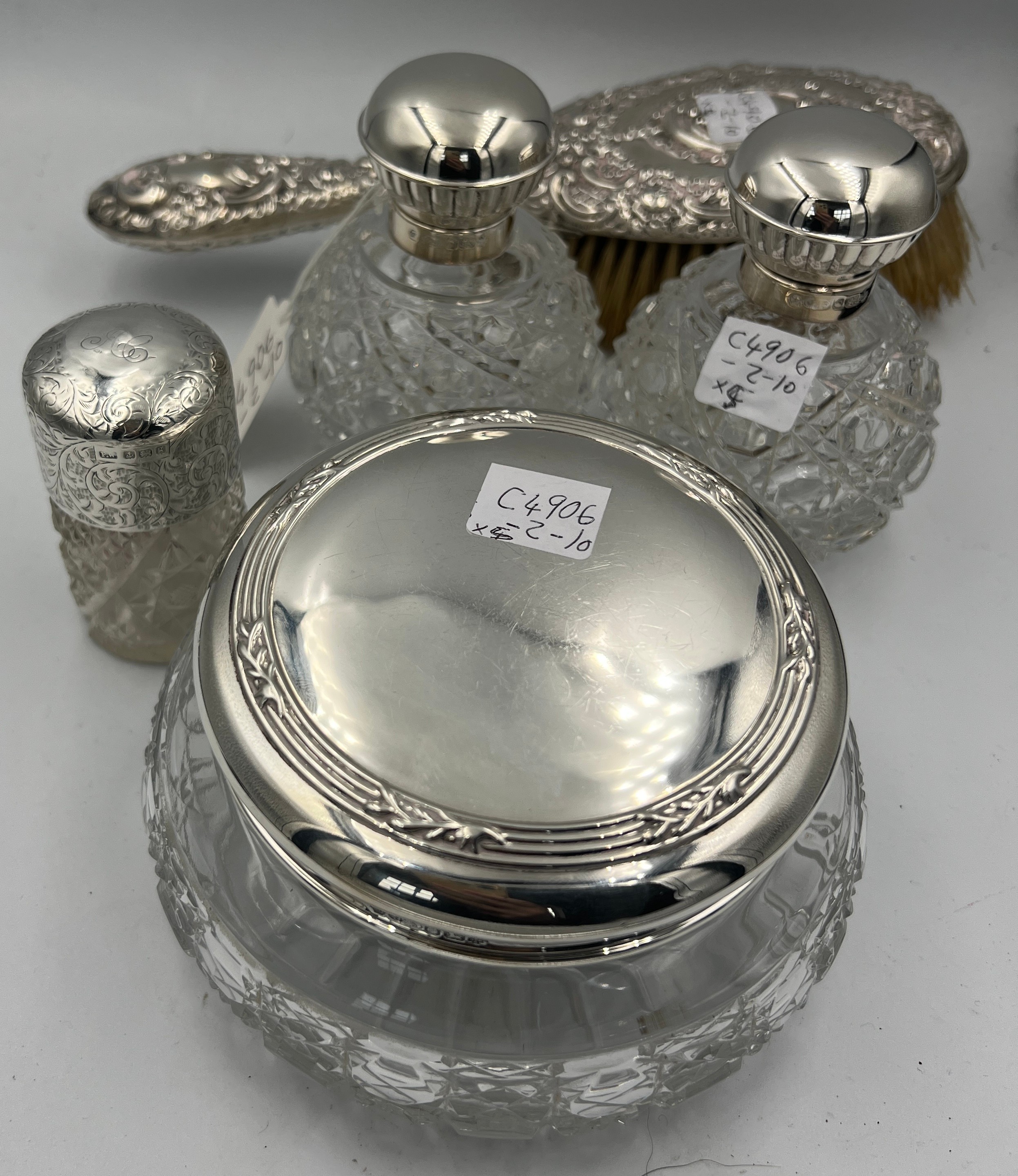 Four silver topped glass dressing table jars. Sheffield 2000, maker Carr’s of Sheffield Ltd and a