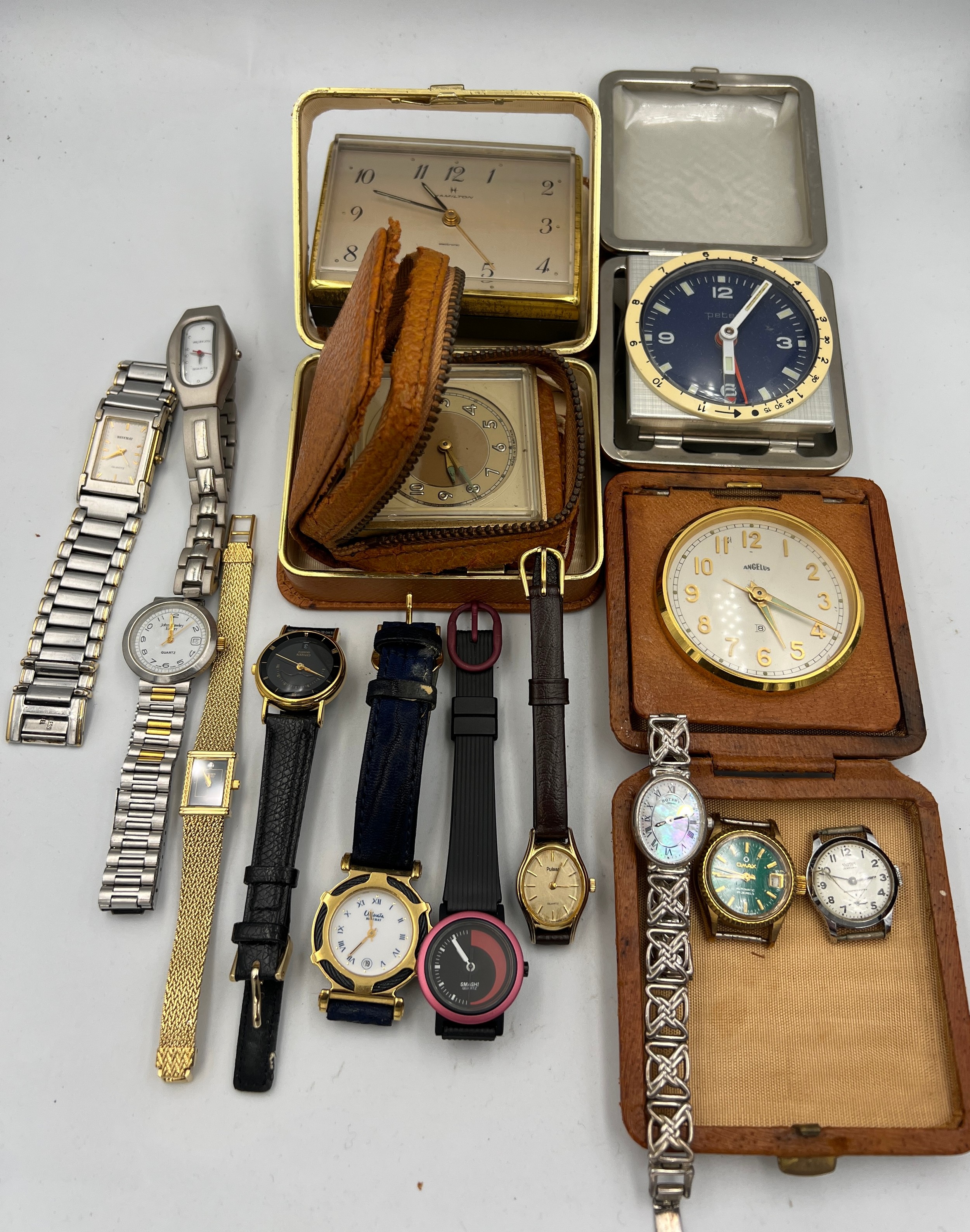A quantity of vintage wristwatches and alarm/travel clocks. To include Smiths, silver Rotary,