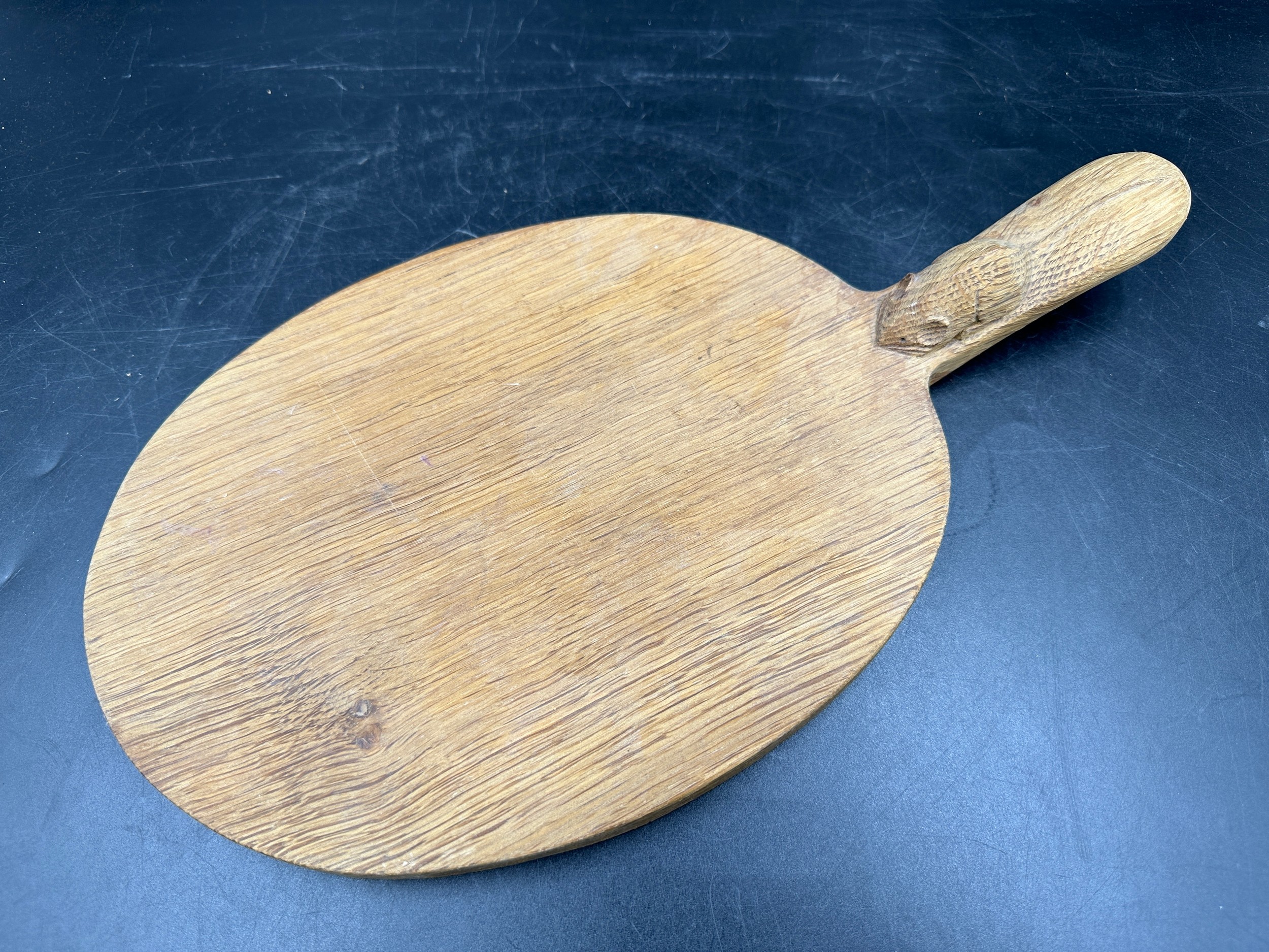 Robert Thompson 'Mouseman' of Kilburn, an adzed oak cheese board of oval form with a carved mouse - Image 2 of 5
