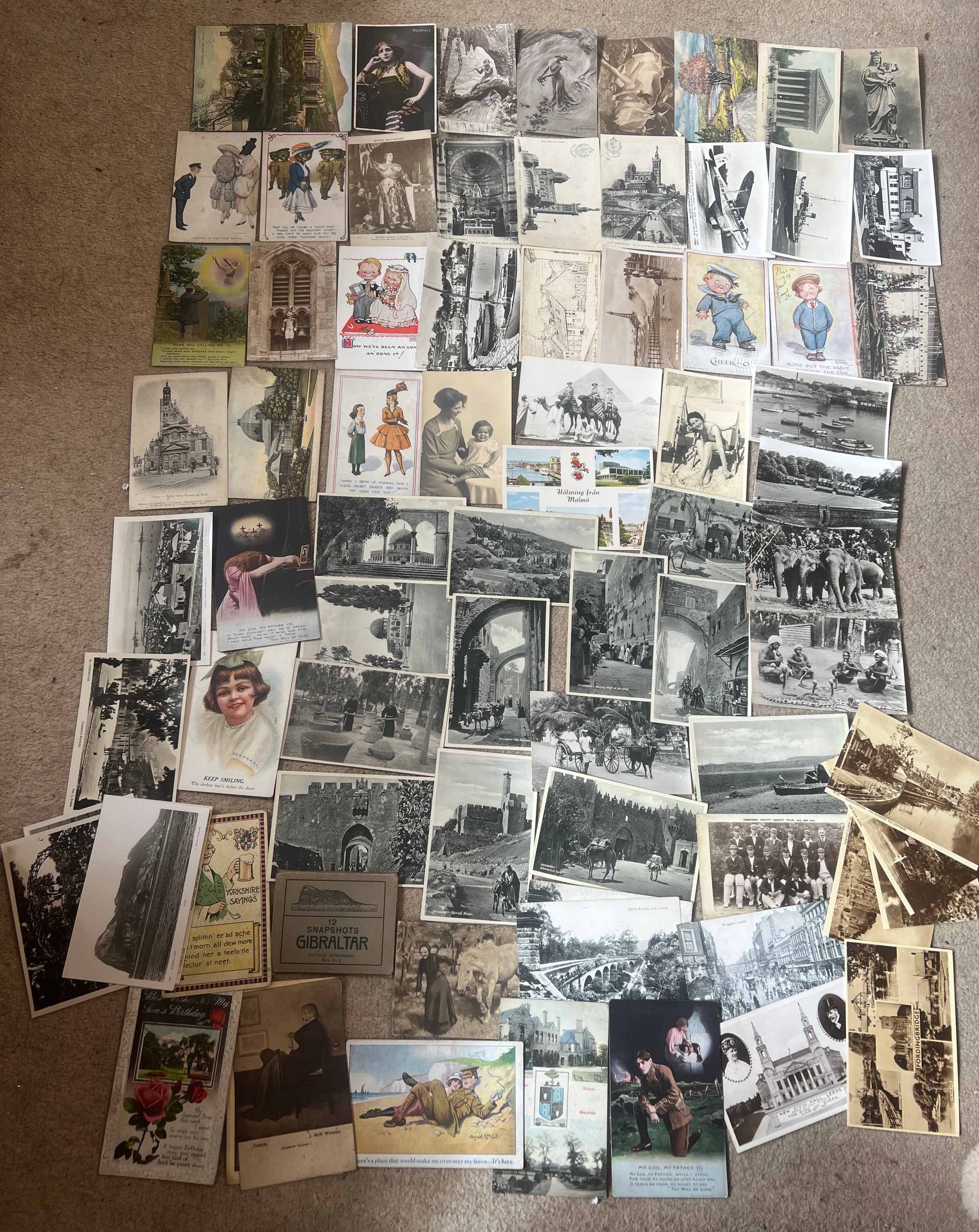 A quantity of vintage postcards to include Egypt, Ceylon, Jerusalem, Leeds, Buxton, Yorkshire County