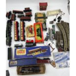 A quantity of vintage train carriages, engine, track etc to include Hornby Dublo, LLedo etc.