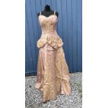 A 1950's Chafil, London full length pink and green demask dress, sleeveless with boned bodice, lined