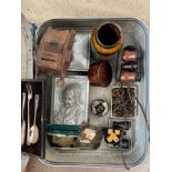 A vintage suitcase and contents to include wooden tank money box dated 1946, opera glasses, metal