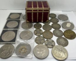 A quantity of coins to include Florins, Half Crowns and Crowns plus Old Spice token and decorative