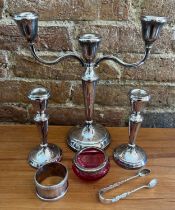 Silver to include candelabra and two candlesticks with weighted bases, Birmingham 1978/79. Maker