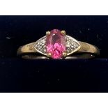A 9 carat gold ring set with pink and clear stones. Size P. Weight 1.7gm.